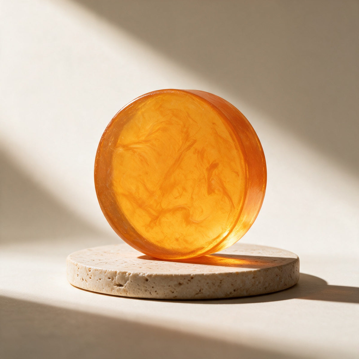Gosho persimmon soap bar on a travertine plinth